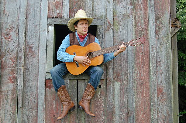 Cowboy e Guitarra - fotografia de stock