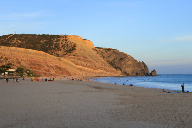 Beautiful sunset at Praia da Luz, Algarve Praia da Luz, Algarve, Portugal- October 20, 2022: Beautiful and colorful sunset at Praia da Luz, Algarve, Portugal luz solar stock pictures, royalty-free photos & images