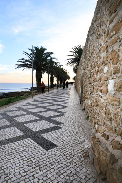 Beautiful cobblestone Promenade at Praia da Luz, Algarve Praia da Luz, Algarve, Portugal- October 20, 2022: Beautiful cobblestone promenade at Praia da Luz, Algarve, Portugal luz solar stock pictures, royalty-free photos & images