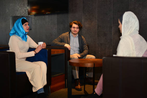 istock Colleagues of mixed ethnicities discuss ideas over coffee. 1729336608