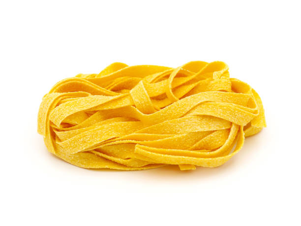 istock Fettuccine pasta nest isolated on white background 1729336621