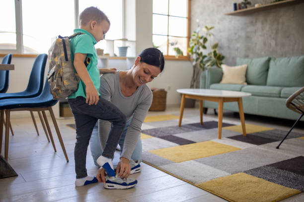 istock Babysitter helping a boy prepare for school 1729338830