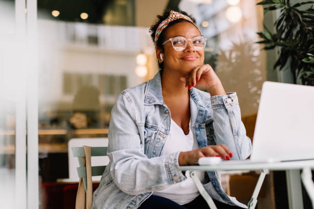 istock Professional woman working remotely in a cozy cafe 1729343310