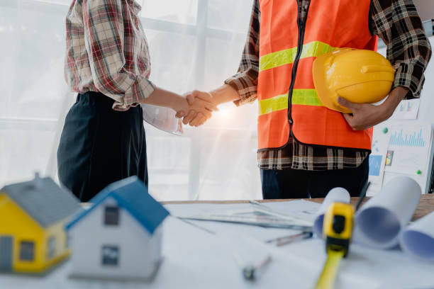 istock Engineers, designers and interior designers are handshake shack hands deal finalizing the design of interiors by discussing selecting materials and colors to design rooms to present to clients. 1729349081