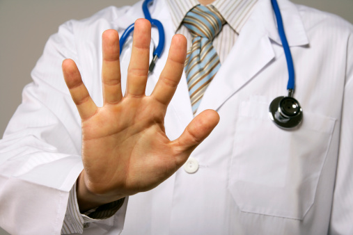 Doctor showing his palm.