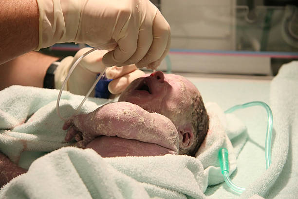 first moment of the newborn baby stock photo