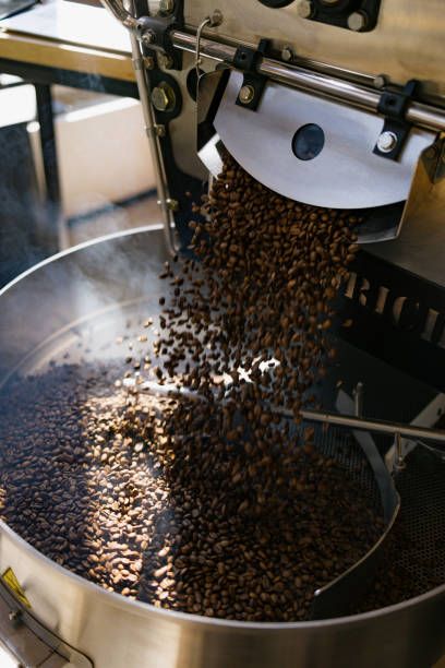 istock Coffee roaster manufacturing roasted coffee beans. 1729350661