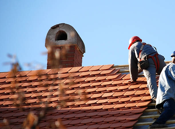 istock roofers working on the roof 172935114