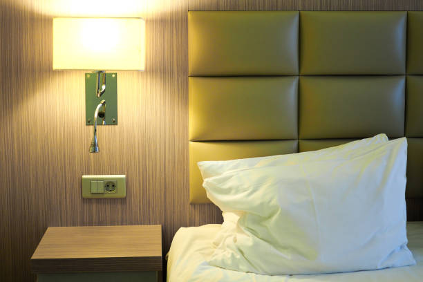 istock Stylish hotel room interior with big comfortable bed and lamp 1729351757