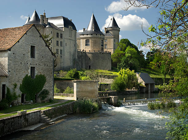 Verteuil, near Angouleme "The river Charente at Verteuil, France showing the chateau and other town buildings" angouleme stock pictures, royalty-free photos & images