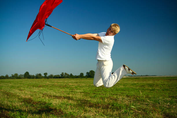 istock Boy and Umbrella - Heavy Wind, funny 172936739