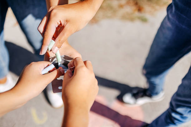 istock Hands of young girl taking out chalks from a box 1729368915