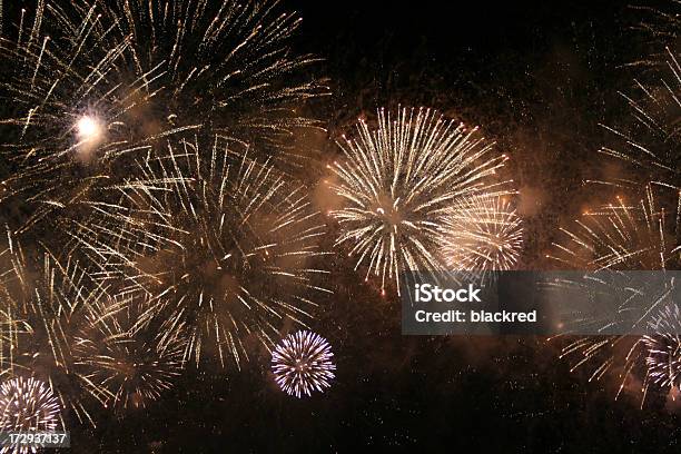 New Year Firework Display On Night Sky Stock Photo - Download Image Now - Abstract, Anniversary, Arts Culture and Entertainment