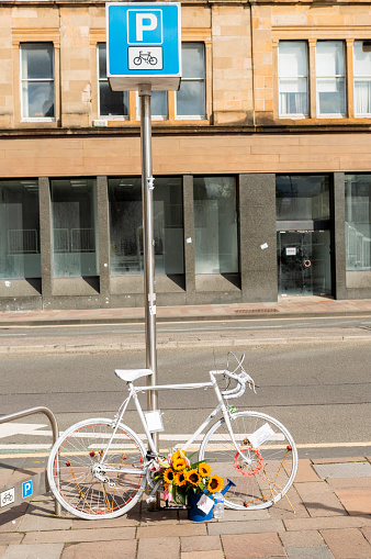 Street view with bcycle to memorial at glasgow scotland england UK