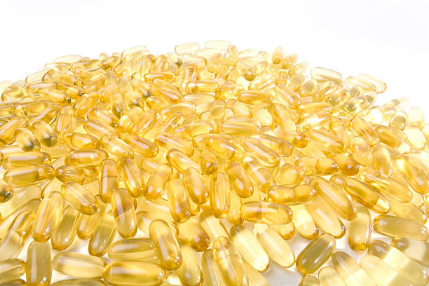 скатанный геля капсулы - vitamin e lecithin nutritional supplement vitamin pill стоковые фото и изображения