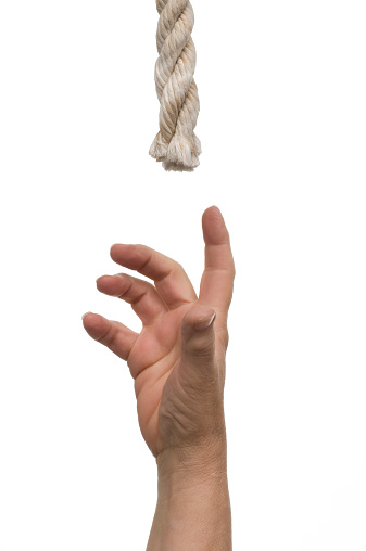 hand  straining-reaching up for a rope or letting go of a rope. want help, or giving up?Isolated on 255 white background.http://www.garyalvis.com/images/conceptsIdeas.jpg