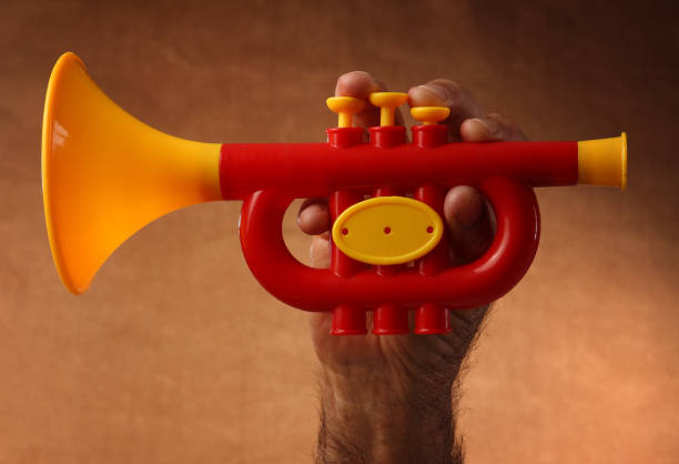 Tricolor toy trumpet with the colors of the Mexican flag to celebrate Independence Day of Mexico and Revolution Day