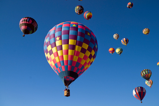 Blue sky full of colorful hot air balloons.