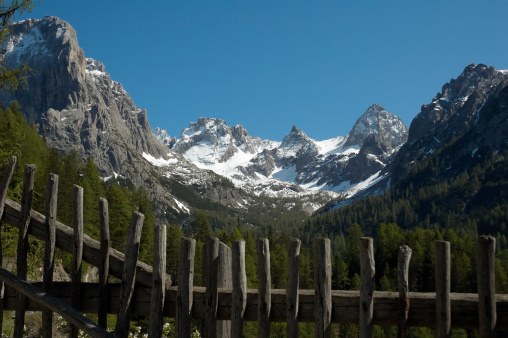 Mountain range behind a wooden fencemore scenics...