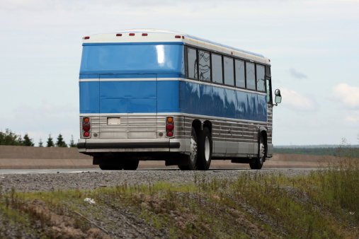 Two axle, rear engine, air-conditioned luxury bus , speeding on a highway in Pune, Maharashtra, India.