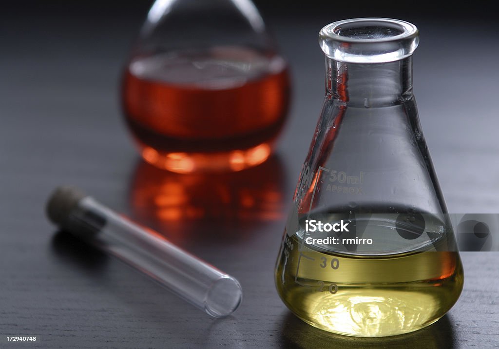 Beakers and test tubes Beakers and test tubes with selective focus Acid Stock Photo