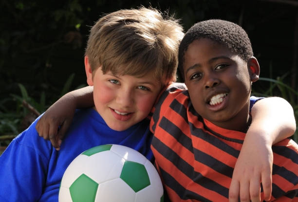 istock Friends with a football 172940915
