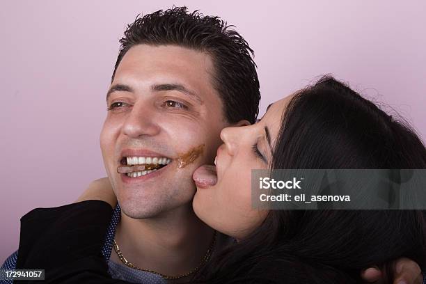 Young Amorous Couple Playfully Eating Chocolate Stock Photo - Download Image Now - Licking, Chocolate, Love - Emotion