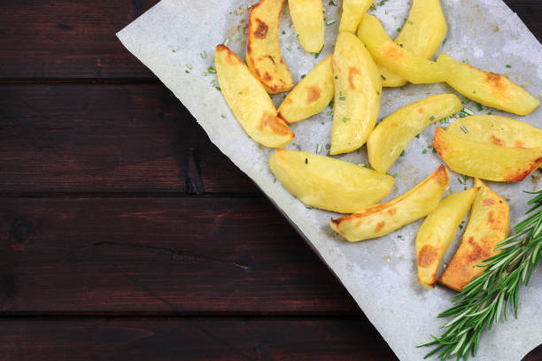 istock Roasted potatoes with rosemary. 1729411302