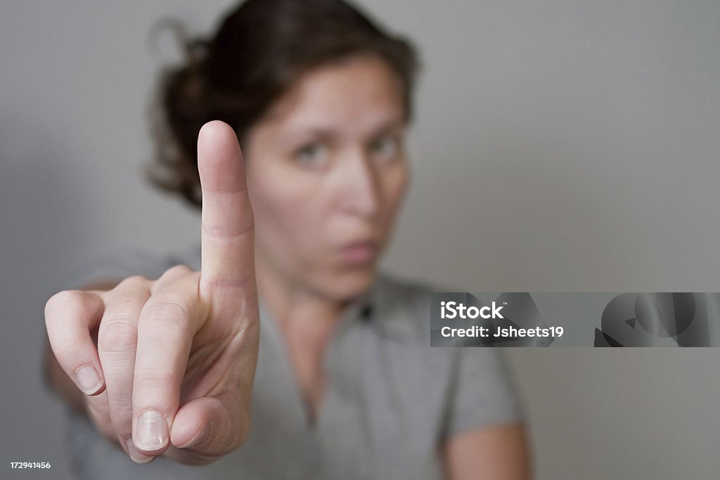 Wait a second Woman with only hand in focus. Adult Stock Photo