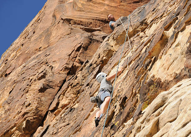 istock Woman Climbing Real Rock Wall 172941670