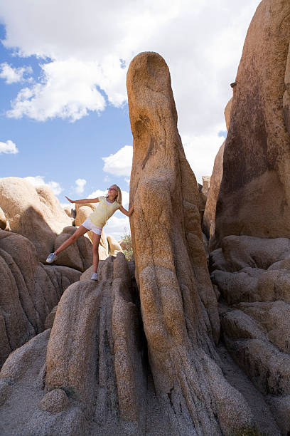 istock girl climbing rocks 172941967