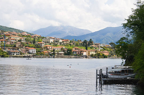 Colorful homes and dock on lake stock photo