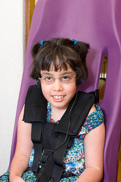 istock disabled girl in special seating 172942281