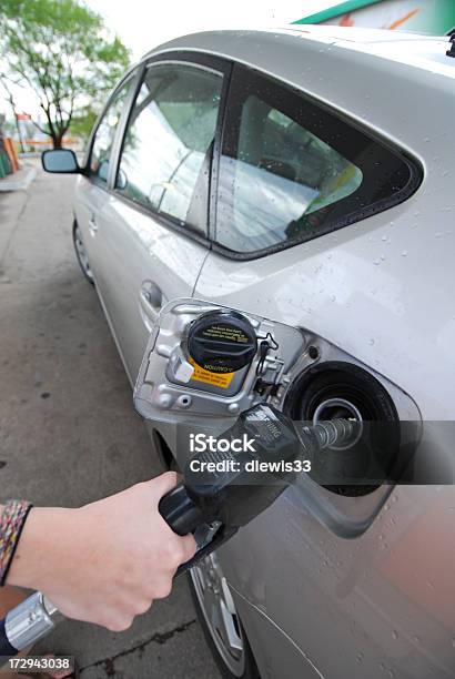 Filling Up A Hybrid Stock Photo - Download Image Now - Adult, Alternative Fuel Vehicle, Car