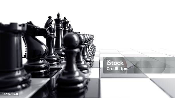 Black Chess Pieces Aligned On The Left Side Of The Board Stock Photo - Download Image Now