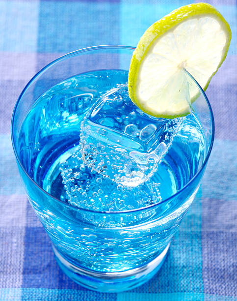 Refreshing water Cold water with lemon and cube of ice soda water glass lemon stock pictures, royalty-free photos & images