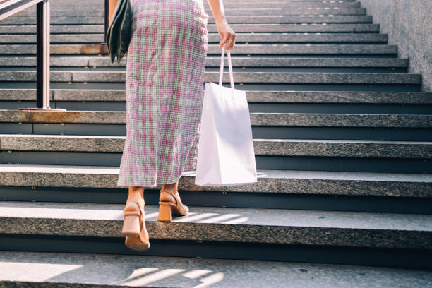 istock Anonymous Businesswoman Walking On The Street After Work 1729432452