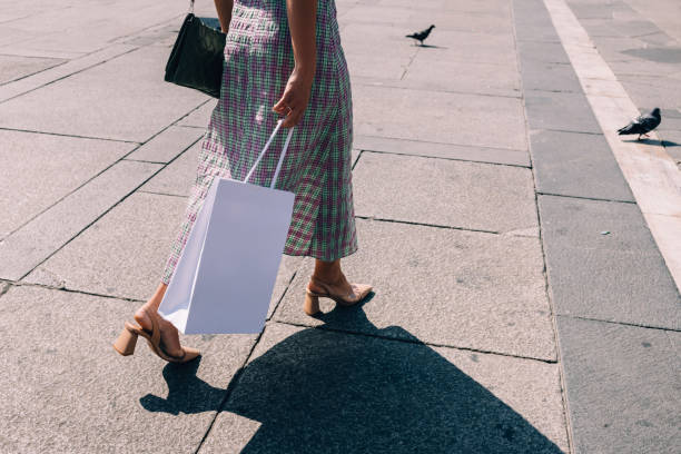 istock Anonymous Businesswoman Walking On The Street After Work 1729432675
