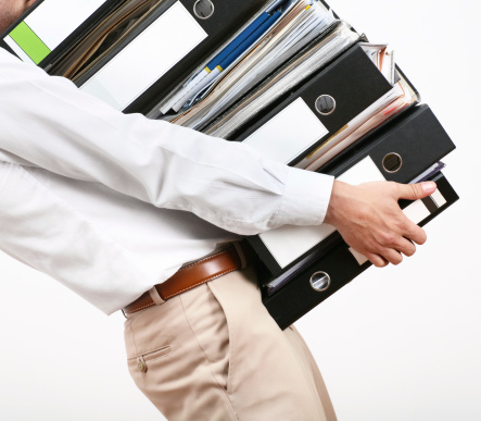 businessman with a stack of files. on  a more or less white background :)