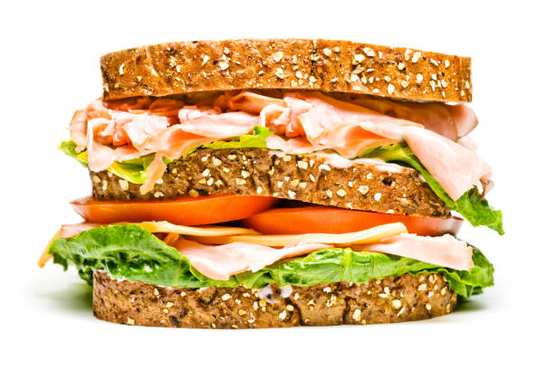 isolated turkey and ham sandwich stock photo