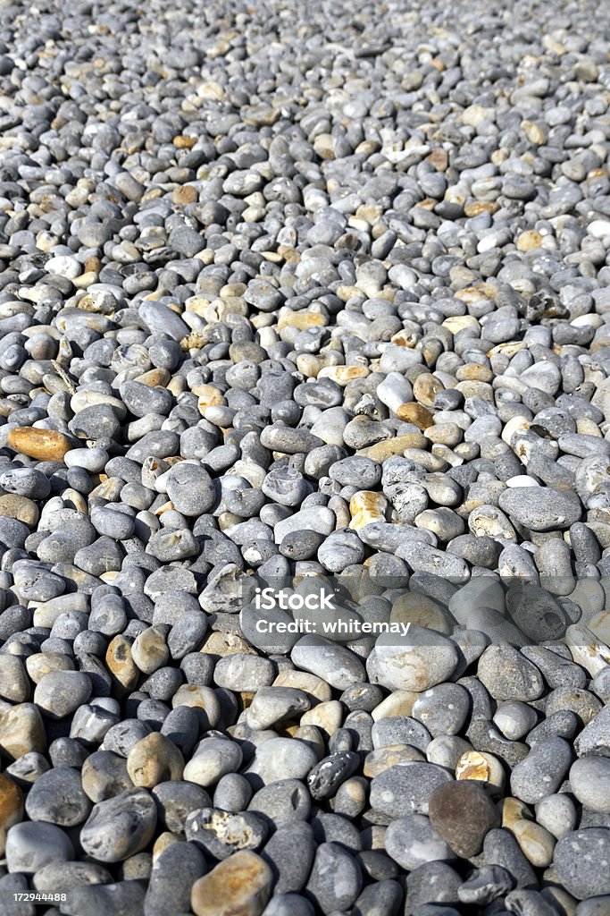 Pebbles "Flint pebbles on Sheringham beach, Norfolk: with focus on foreground." Backgrounds Stock Photo