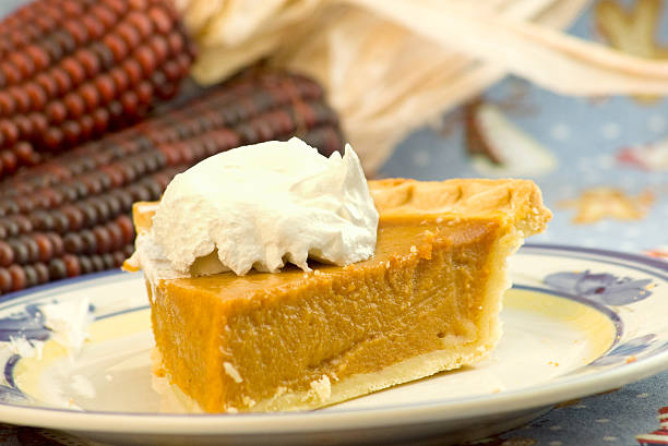 istock slice of pumpkin pie with wihp cream 172945364