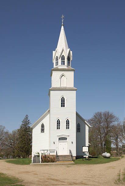istock white country church & clear blue sky 172945567