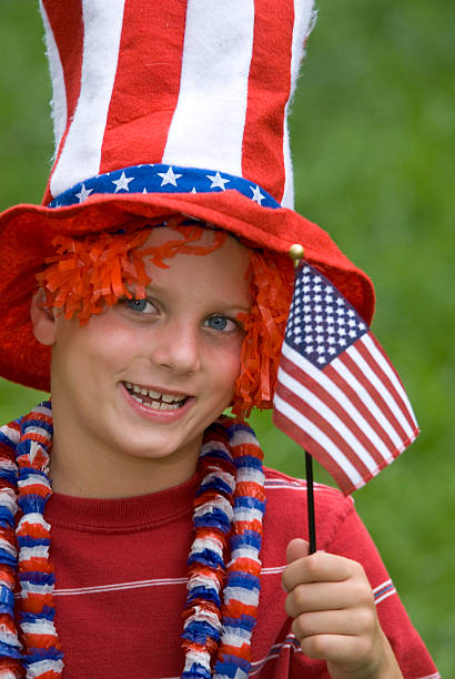 istock 4th of July Boy With Flag and Uncle Sam Hat 172946309
