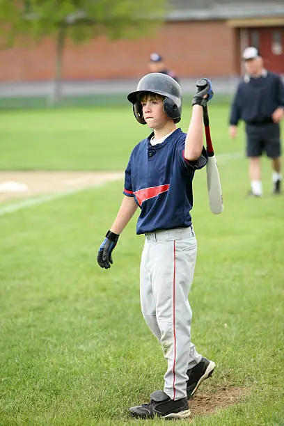 youth baseball player warming up