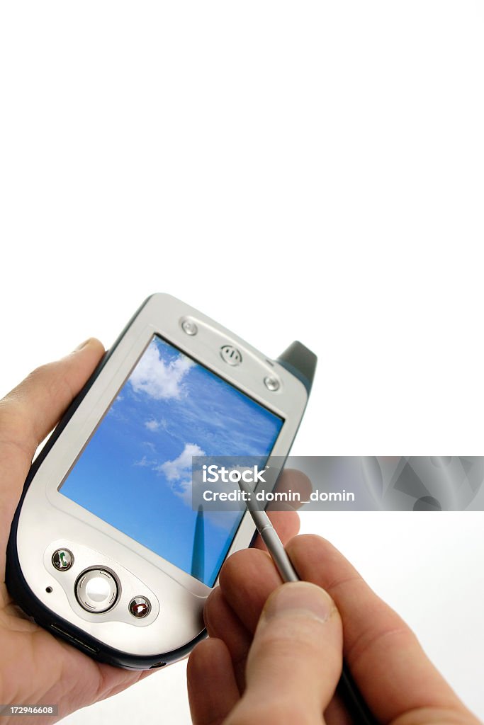 Close-up of man holding in hands mobile phone with scriber Close-up of man holding in hands mobile phone with scriber, studio shot, isolated on white. Accessibility Stock Photo