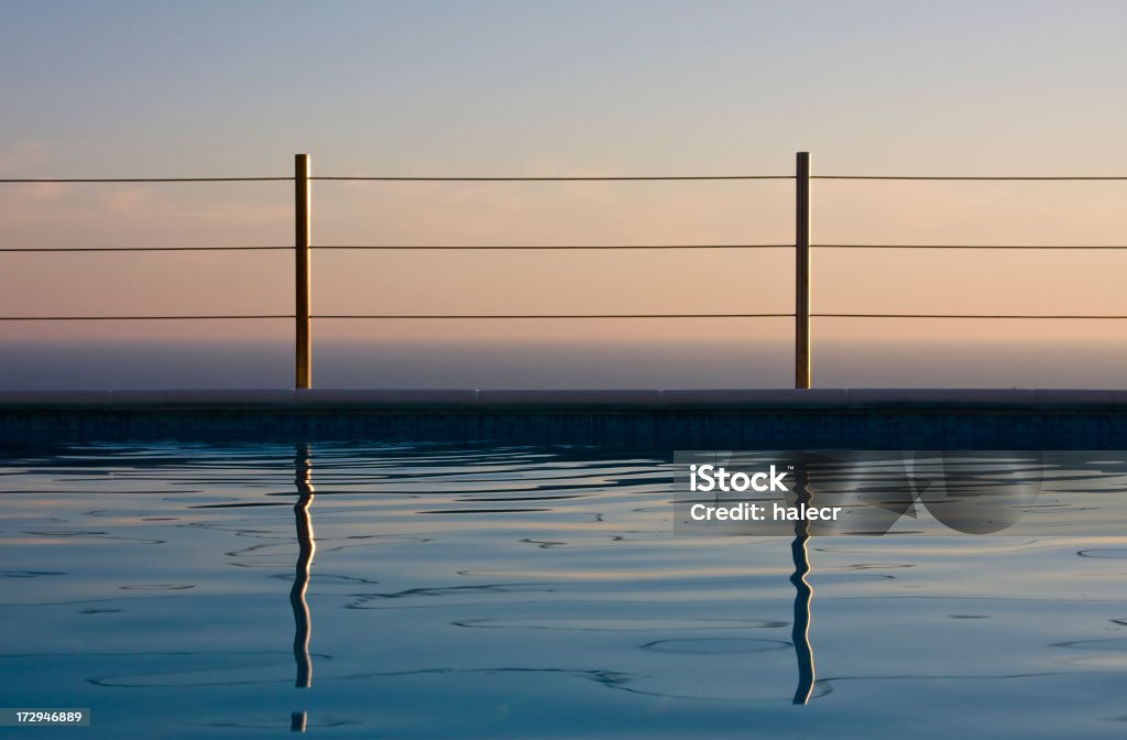 Swimming Pool Vista Coastal view to the horizon over a reflecting swimming pool.Please see some similar images from my portfolio: Adriatic Sea Stock Photo