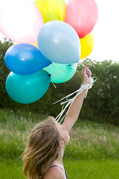 istock young girl playing with balloons 172946945