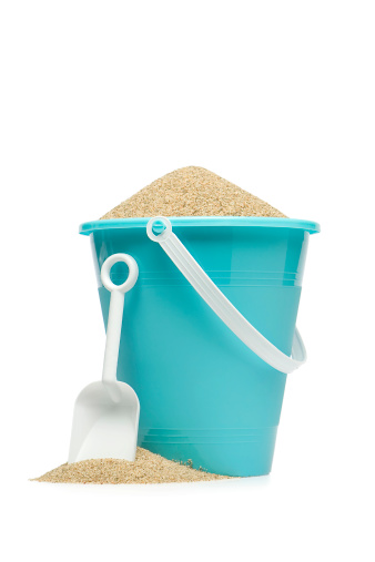 A blue sand pail and shovel against a white background.More in this series: