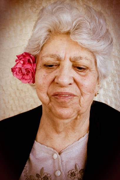 istock Elder female with rose 172947258